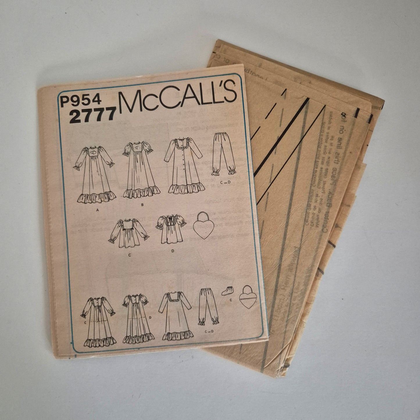 McCall's 2777, girls nightgown robe pajamas bootees and bag pattern. Size S (4-6)