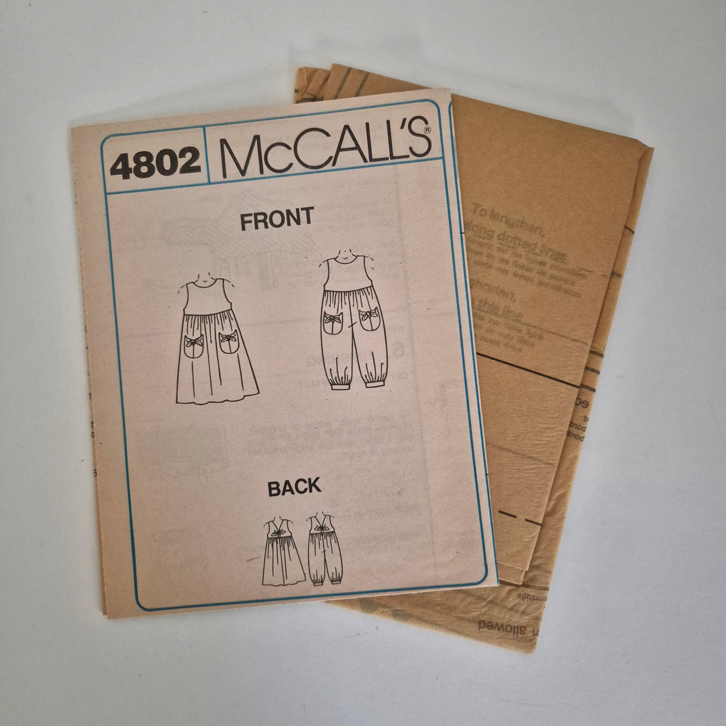 McCall's 4802, girls jumpsuit and sundress pattern, size 7 to 10