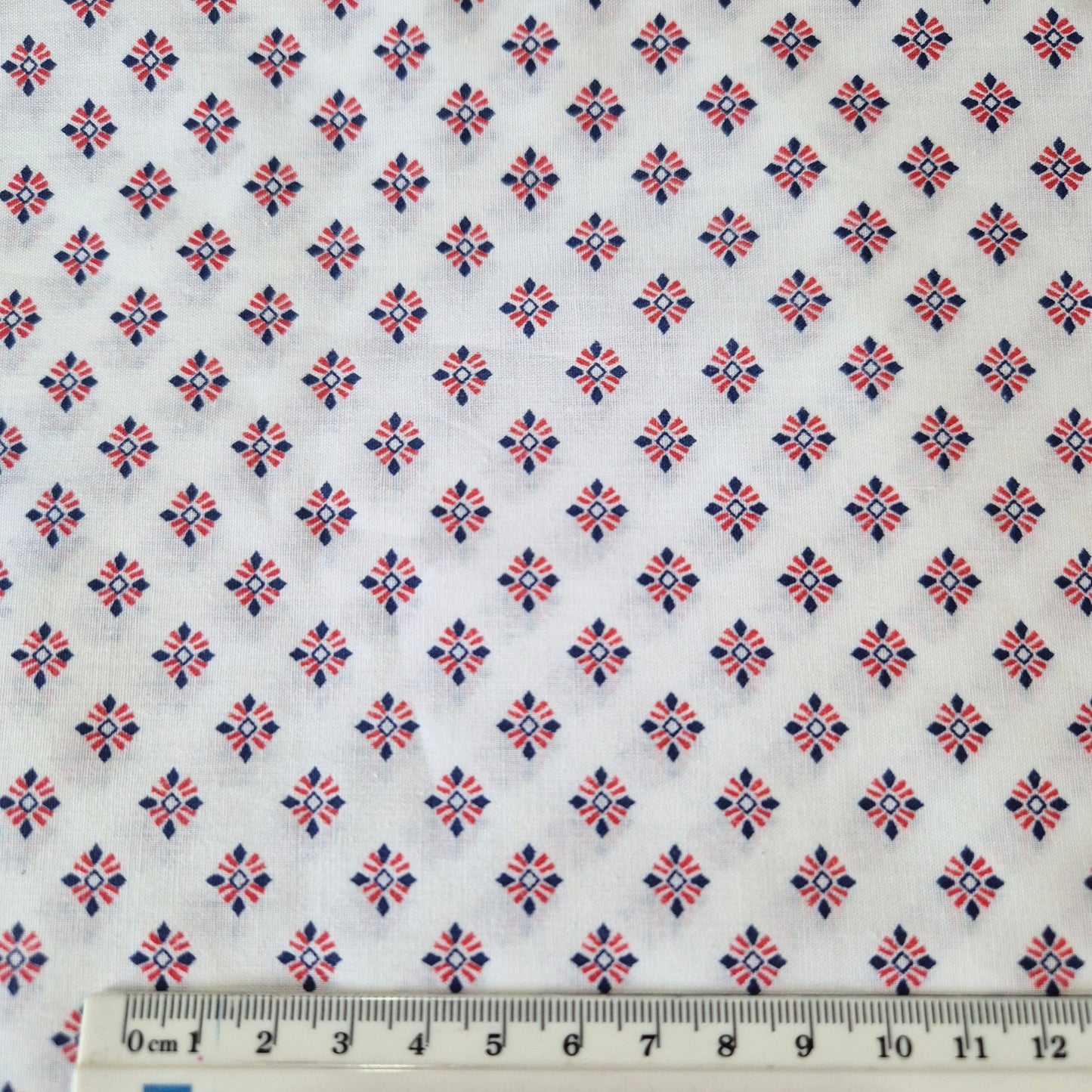 fabric with ruler to show design size