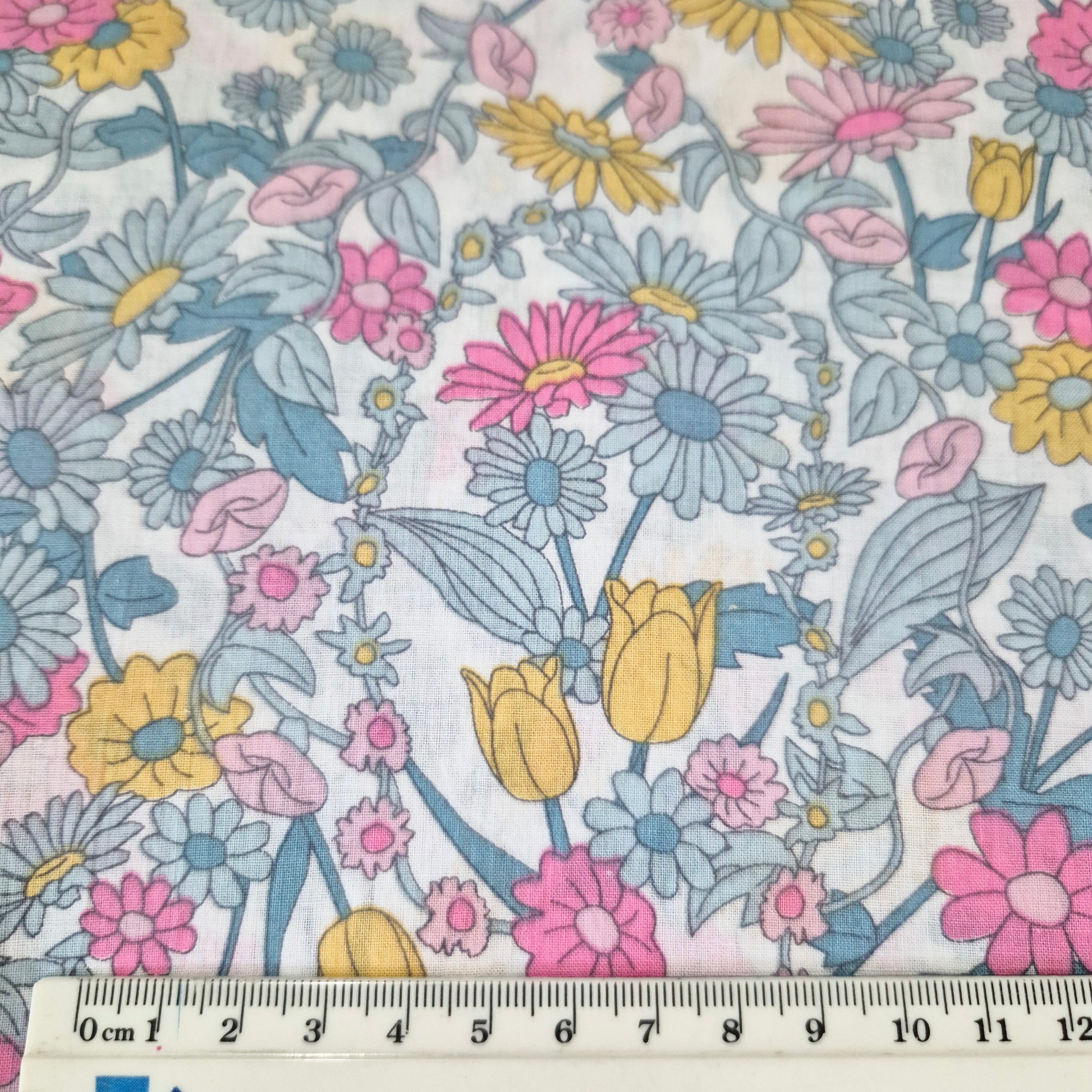 fabric with ruler to show design size