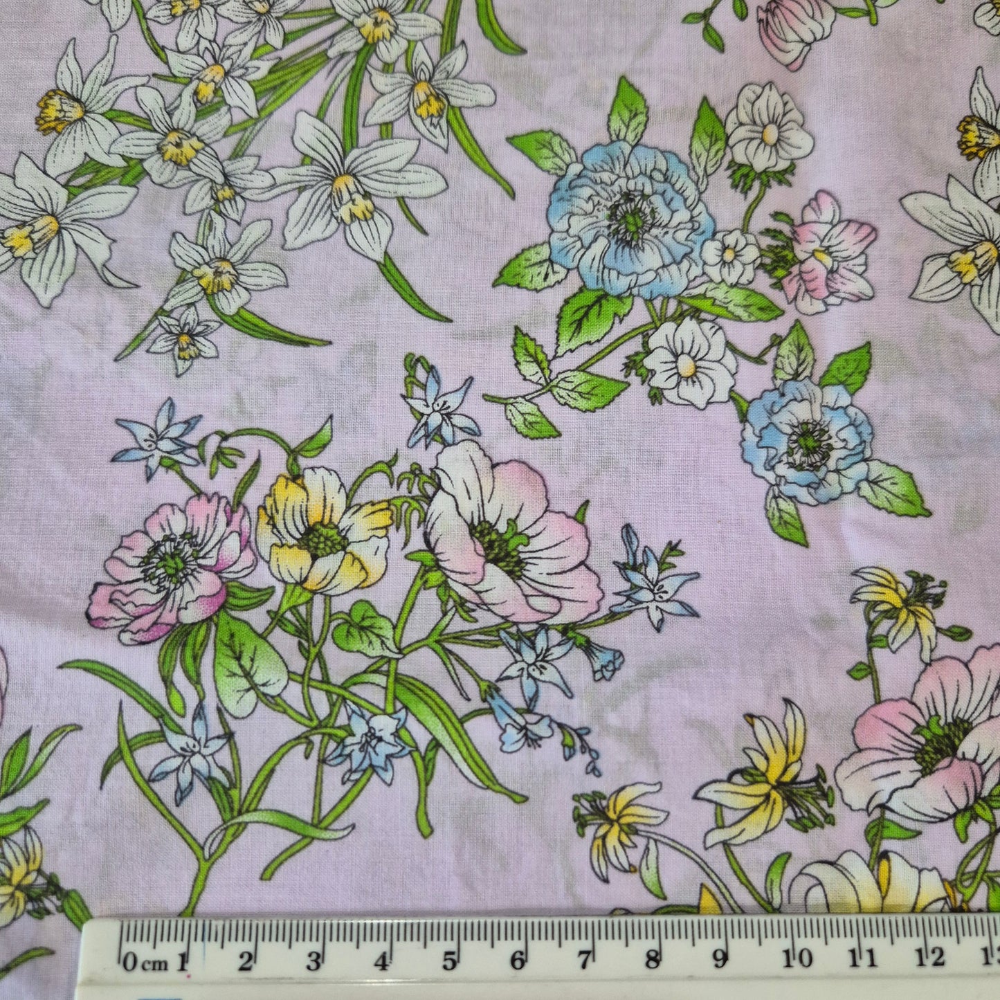 fabric with ruler to show design size